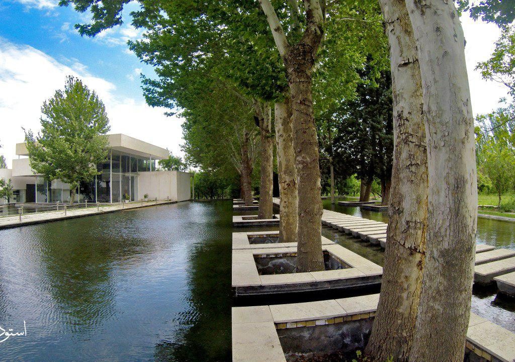 Actual Afarinesh project: trees in water and a stepping path